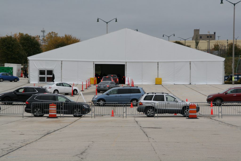 People wait in vehicles to be tested for COVID-19 at Miller Park. Photo by Jeramey Jannene.