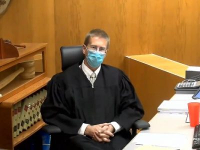 Why Should Court End Mask Mandate, Judge Asks