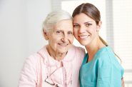 Caregiver with a senior woman in a nursing home. (Public Domain)