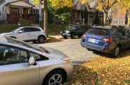 Vehicles parked on a Milwaukee street. Photo by Jeramey Jannene.