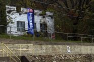 QAnon symbol painted on retaining wall in Ferryville, WI. Henry Redman | Wisconsin Examiner