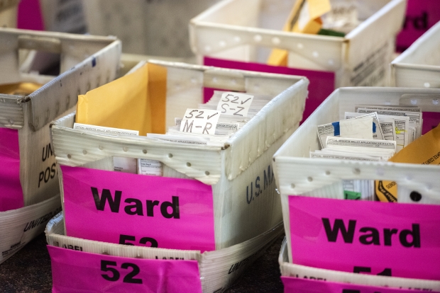 Absentee ballots are stored in box Tuesday, Nov. 3, 2020, at Milwaukee’s Central Count facility. Angela Major/WPR