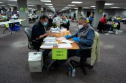 Election workers count ballots at the Milwaukee Central Count location after the polls had closed for the evening, on Nov. 3, 2020. Eric Kleppe-Montenegro for Wisconsin Watch