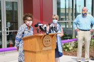 New library director Joan Johnson addresses a crowd during the ribbon-cutting ceremony for the Good Hope Library in July. Also pictured are former library director Paula Kiely and Mayor Tom Barrett. Photo by Jeramey Jannene.