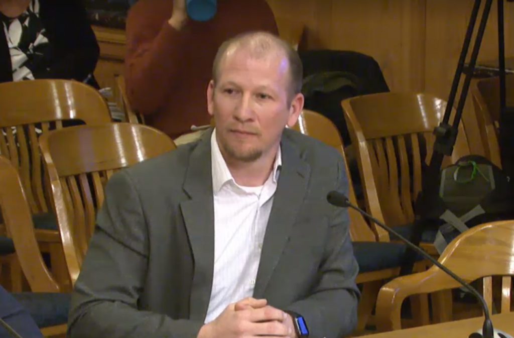 Jerrel Kruschke appears before the Public Works Committee in March 2019. Image from City Channel - City Clerk's Office.