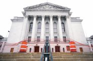 Cones and fencing are put up to block off an area outside of the Wisconsin State Capitol on Sunday, Jan. 17, 2021, in Madison, Wis. Angela Major/WPR