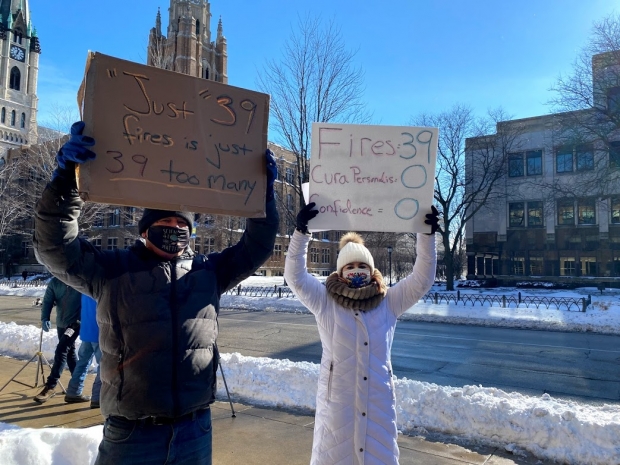 French professor Sarah Gendron, right, and her husband, Bill Bristoll, joined around 30 members of the campus community to protest the layoff of 39 staff members in January. Corrinne Hess/WPR