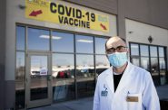 Hashim Zaibak, a founder and pharmacist at Hayat Pharmacy in Milwaukee, stands outside of his business on March 11, 2021. The pharmacy offers walk-in hours for COVID-19 vaccine seekers — an effort to bolster access to those who might otherwise run into technological or language barriers when trying to schedule appointments. Angela Major / WPR