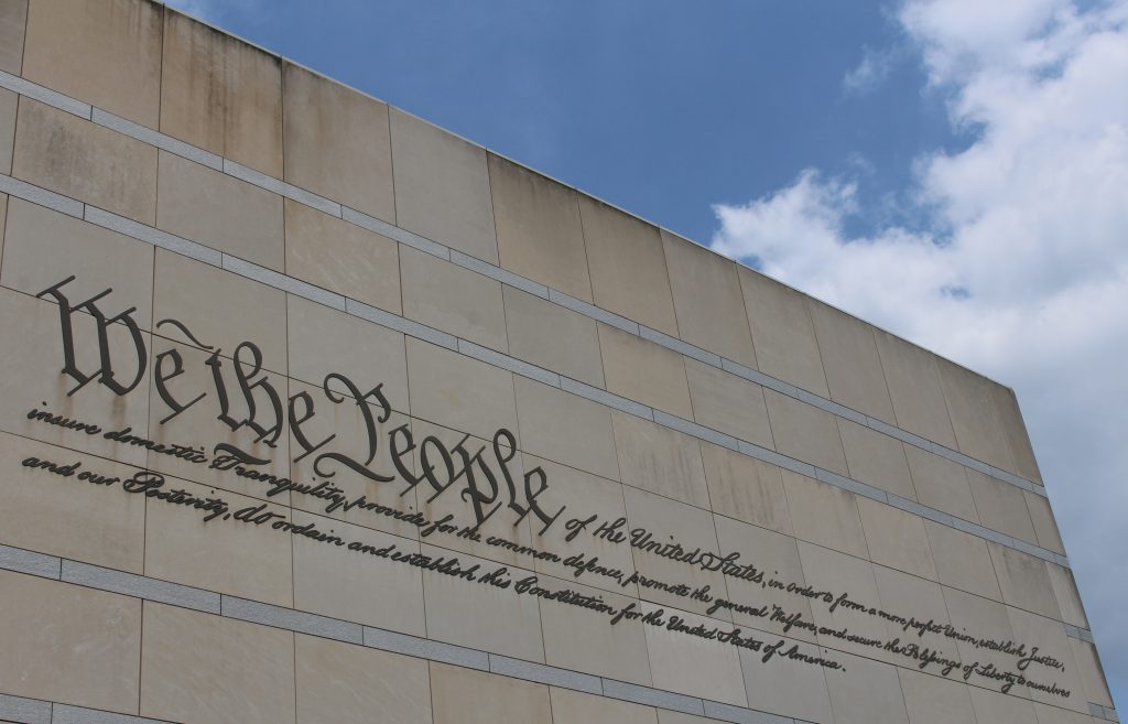 "We the People" inscription on the Front of the National Constitution Center. Photo by Housefinch1787, CC BY-SA 4.0 , via Wikimedia Commons