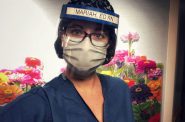 Mariah Clark is an emergency room nurse who works at UW Health. She is seen here in the personal protective equipment (PPE) that she wore at work at the beginning of the pandemic. Courtesy of Mariah Clark