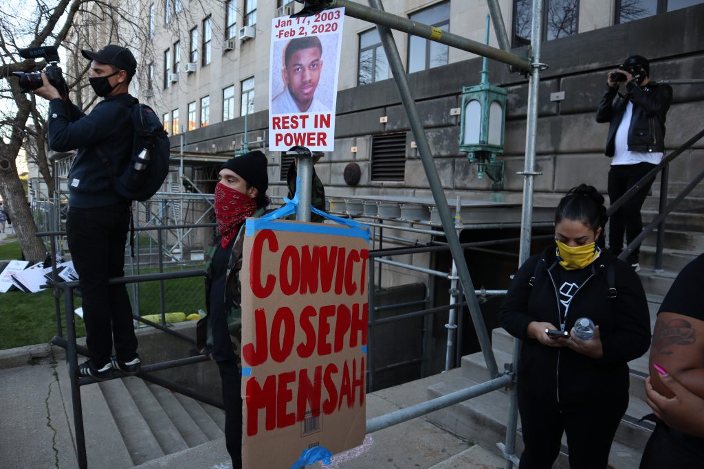 Protesters gather outside of the Milwaukee Safety Building waiting for the Cole family to come out with DA Chisholm's decision. Photo by Isiah Holmes/Wisconsin Examiner.