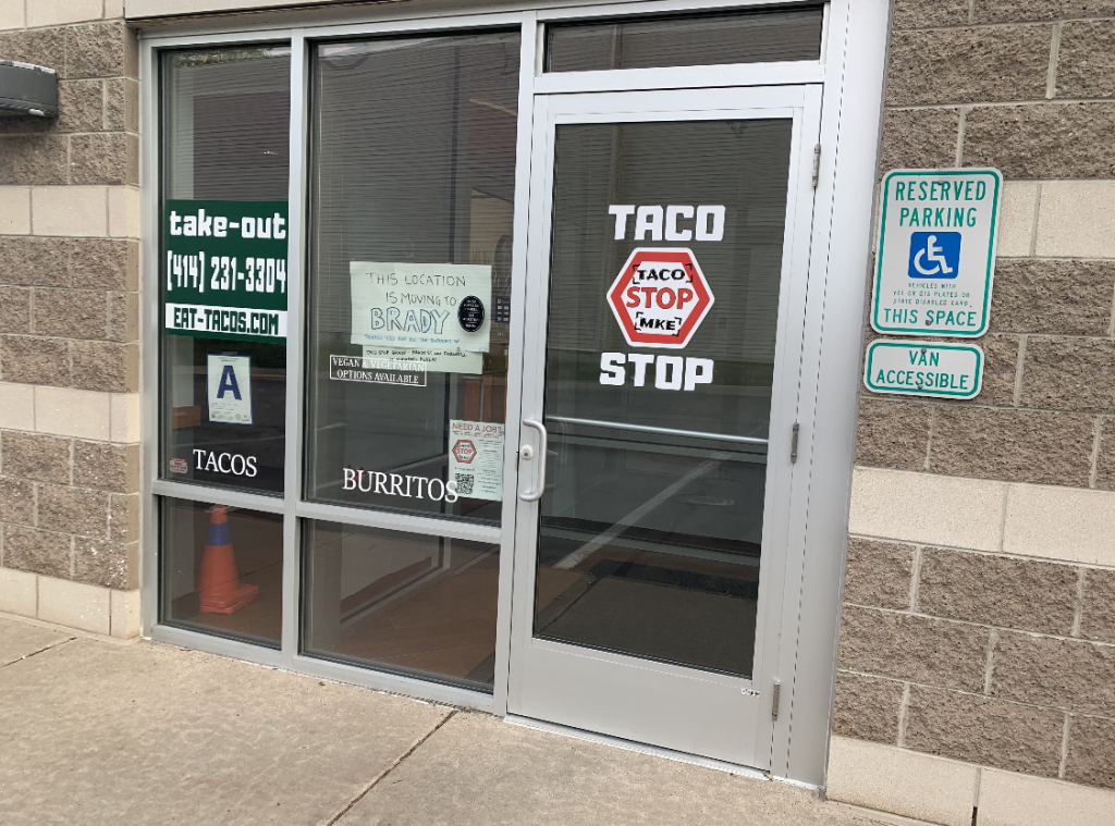 Sign in the window of Taco Stop MKE's Bay View location. Photo by Jeramey Jannene.