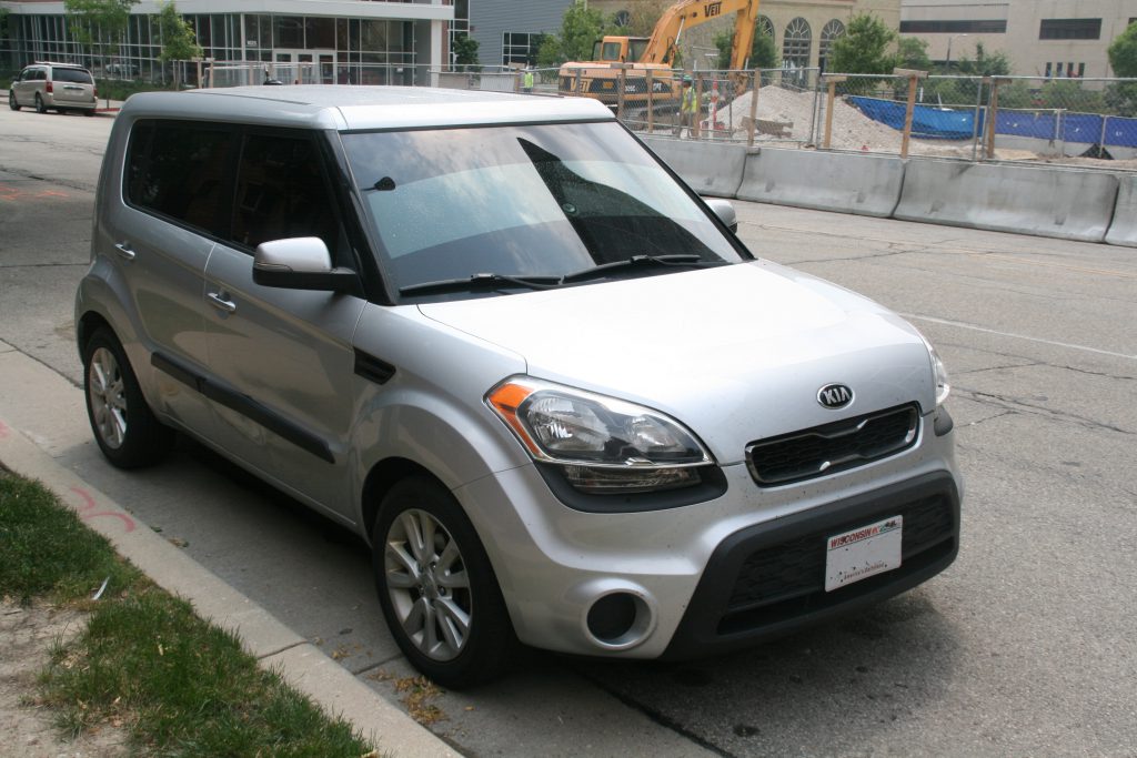 A Kia parked on a City of Milwaukee street. Photo by Jeramey Jannene.