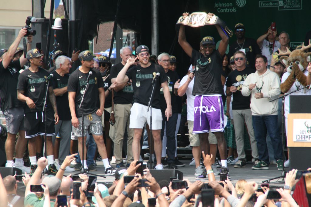 Pat Connaughton encourages the crowd to cheer for Bobby Portis (holding belt). Photo by Jeramey Jannene.