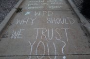 Protesters marked the ground outside the Wauwatosa City Hall with chalk displaying a variety of messages. Photo by Isiah Holmes)/Wisconsin Examiner.