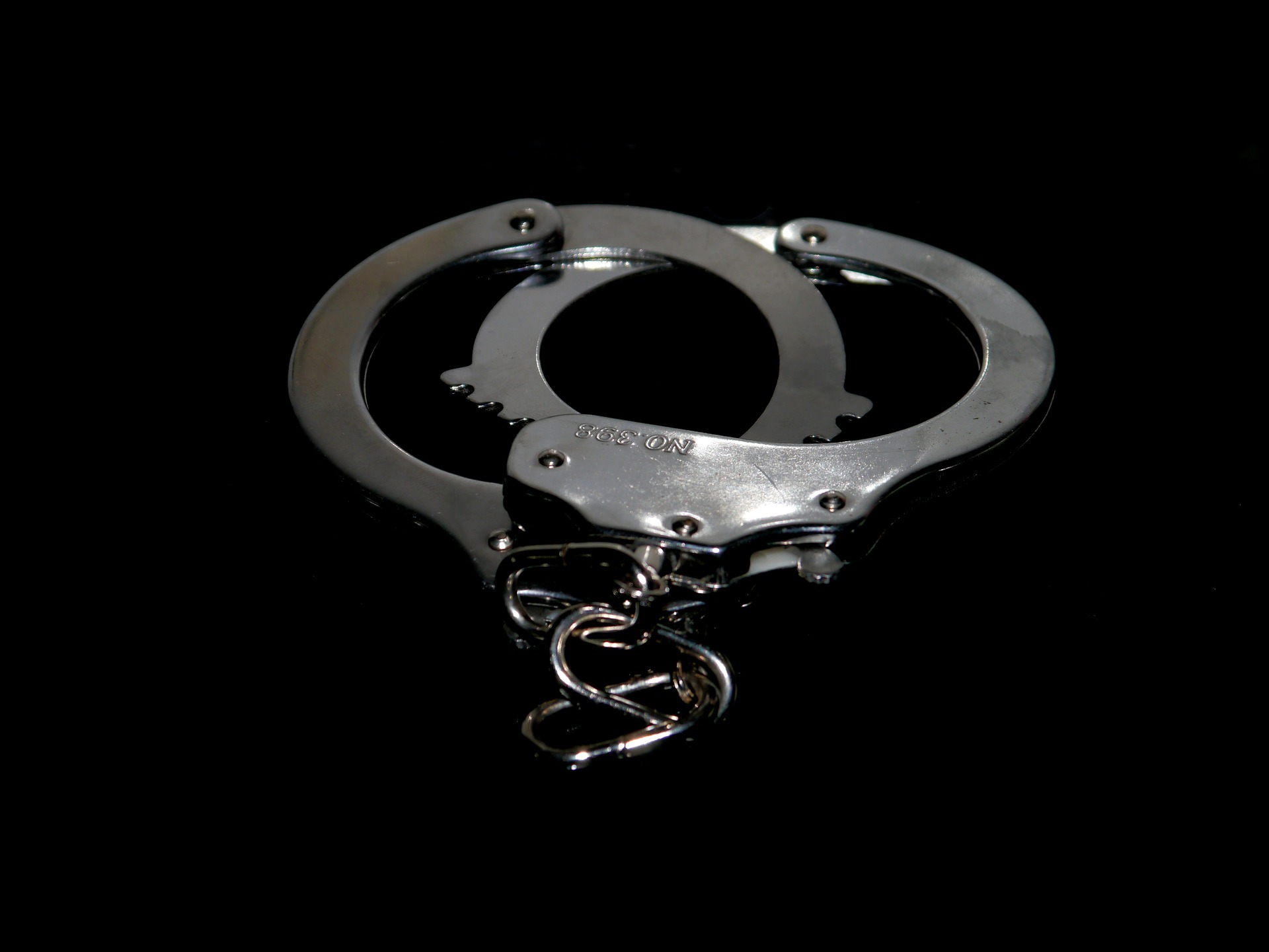 Handcuffs. (Pixabay License).