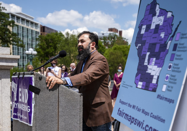 Fair Elections Project director Sachin Chheda speaks to a crowd Monday, May 17, 2021, in Madison, Wis. Angela Major/WPR