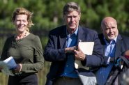 U.S. Sen. Tammy Baldwin, left, U.S. Rep. Ron Kind, center, and U.S. Rep. Mark Pocan, right, hold notes as they walk up to address reporters Tuesday, Sept. 7, 2021, at Fort McCoy between Sparta and Tomah, Wis. Angela Major/WPR