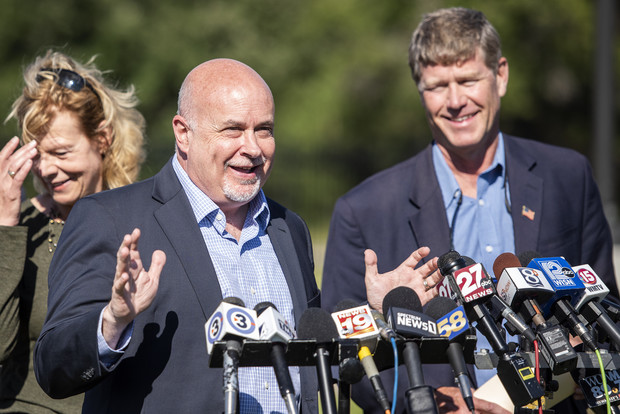 U.S. Rep. Mark Pocan stands near U.S. Sen. Tammy Baldwin and U.S. Rep. Ron Kind while addressing reporters at a news conference Tuesday, Sept. 7, 2021, at Fort McCoy between Sparta and Tomah, Wis. Angela Major/WPR