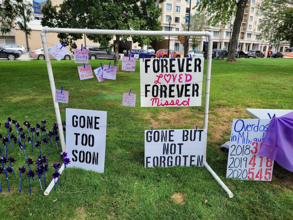 Visitors hung notes on a display at the International Overdose Awareness Day memorial event at Zeidler Union Square in downtown Milwaukee. Photo by Edgar Mendez/NNS.