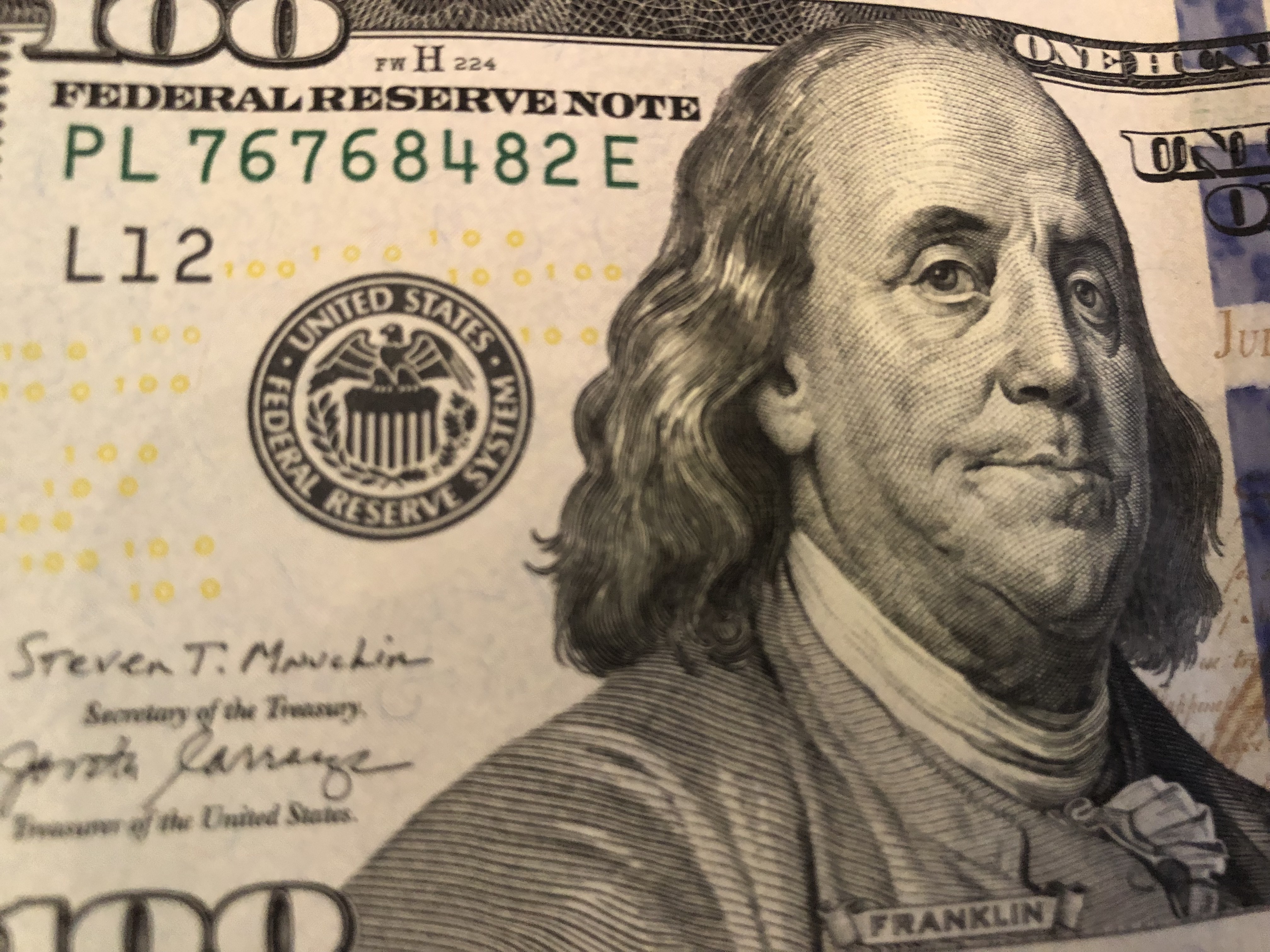 100 Dollar Bill. Photo by Dave Reid.