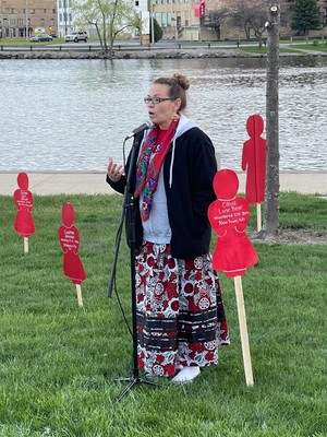 Kristin Welch, member of the Menominee Nation and MMIW Task Force, speaks at a Bridge Lighting on May 5, 2021 to honor the National Day of Awareness for Missing and Murdered Indigenous Women and Girls. Hannah Schmidt/WPR.