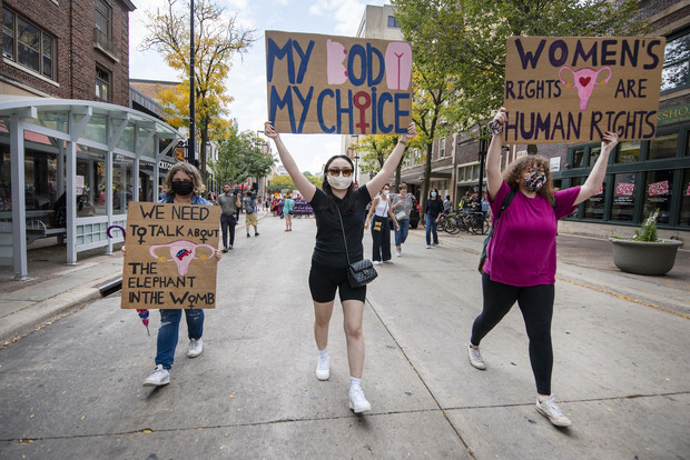 Protesters hold signs in support of abortion rights Saturday, Oct. 2, 2021, in downtown Madison, Wis. Angela Major/WPR