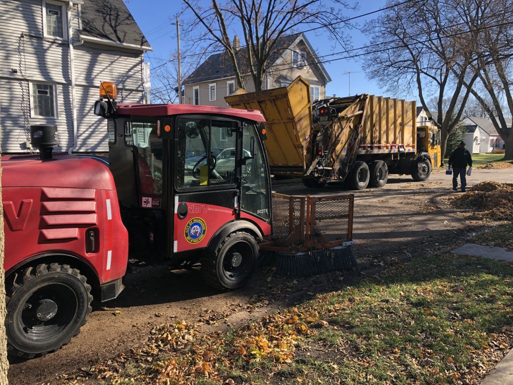 A Department of Public Works crew picks up leaves in Bay View in Nov. 2020. Photo by Jeramey Jannene.
