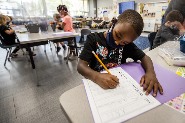 First-grader Ke'Marion Brown practices writing letters in class Friday, Sept. 17, 2021, at Hackett Elementary School in Beloit, Wis. Angela Major/WPR