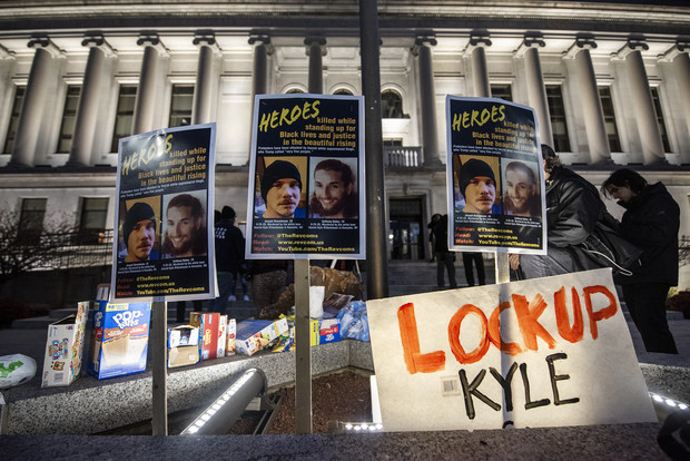 Signs are posted outside the Kenosha County Courthouse during the Kyle Rittenhouse trial Wednesday, Nov. 17, 2021, in Kenosha, Wis. Angela Major/WPR
