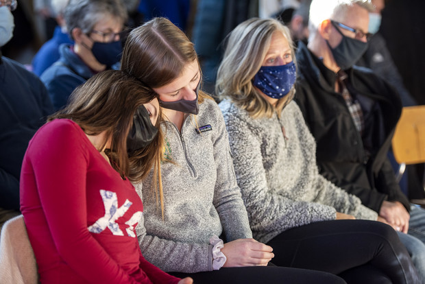 Carroll University students Kiya Wadsworth, left, and Emily Hintz lean on each other as they attend a vigil held by the university after the Christmas parade tragedy Monday, Nov. 22, 2021, in Waukesha, Wis. Angela Major/WPR