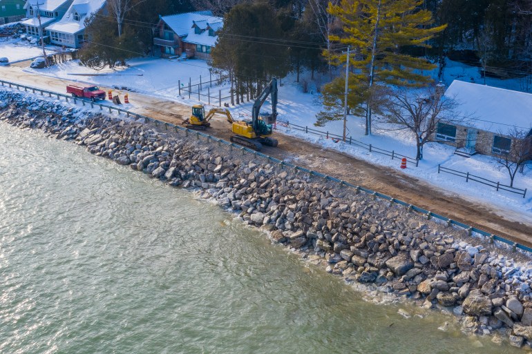 Town of Baileys Harbor, Wis., maintenance crews and contractors work to restore residential access with giant limestone boulders after the road collapsed into Lake Michigan due to high water levels. Photo taken Dec. 19, 2019. Brett Kosmider / Door County Pulse.