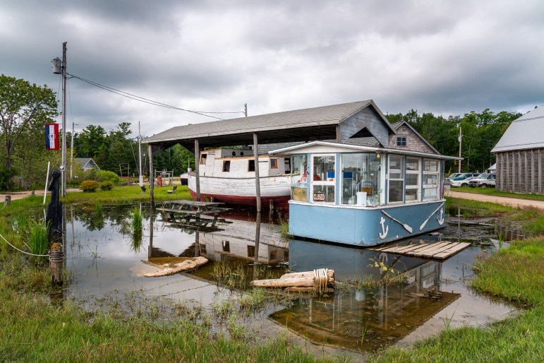 Lake Michigan’s waters reached record highs in July 2020, inundating buildings on Washington Island, which sits off of Wisconsin’s Door Peninsula. Here, water is inches away from completely submerging piers at Jackson Harbor on July 24, 2020. Brett Kosmider / Door County Pulse