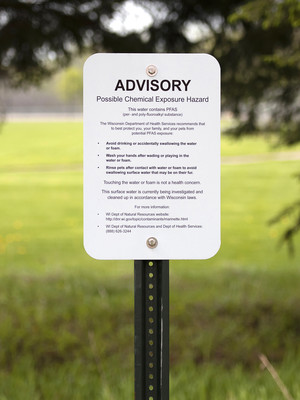 A sign at Marinette High School warns of PFAS contamination in water that runs through the school’s campus Thursday, May 20, 2021. Angela Major/WPR