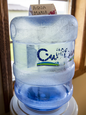 Mary Wetterling named the water dispenser at her French Island, Wis., home “Aqua Maria.” More than 1,000 residents are currently receiving bottled water there. Angela Major/WPR
