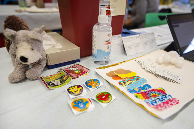 Stickers and colorful bandages are displayed on a nurse’s table at a COVID-19 vaccine clinic Monday, Nov. 8, 2021, at Townsend Public School in Milwaukee, Wis. Angela Major/WPR