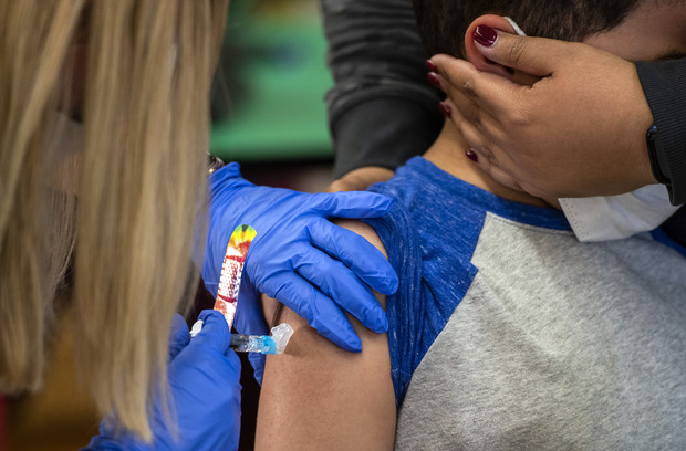 Nine-year-old Jean Aguayo receives both a COVID-19 and influenza vaccine Monday, Nov. 8, 2021, at Townsend Public School in Milwaukee, Wis. Angela Major/WPR