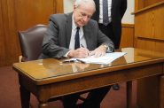 Mayor Tom Barrett signs his resignation letter. Photo by Jeramey Jannene.
