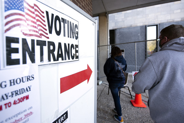 Voters walk to an early voting location Wednesday, Oct. 28, 2020, at Waukesha City Hall. Angela Major/WPR