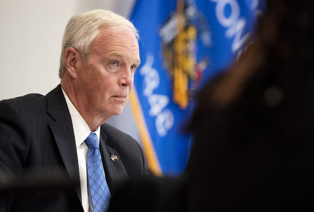Sen. Ron Johnson sits with people from outside of Wisconsin who claim to have had adverse reactions to COVID-19 vaccines Monday, June 28, 2021, at the Milwaukee Federal Building in Milwaukee, Wis. Angela Major/WPR