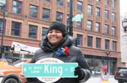 Alderwoman Milele A. Coggs stands with a King Drive street sign in front of the newly-unveiled, official sign at W. Wisconsin Ave. Photo by Jeramey Jannene.