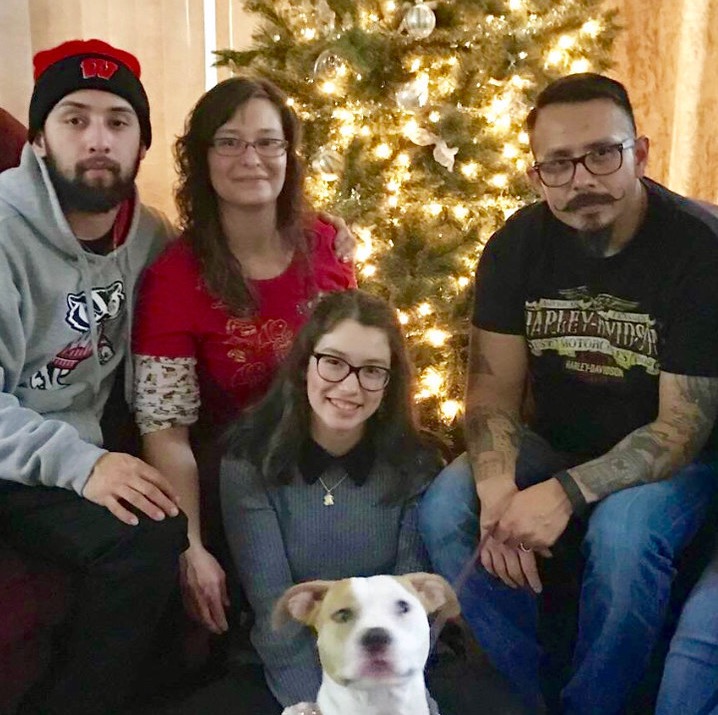 From left, Isaac “Bubba” Solis, Jr.; his mother, Connie; sister, Ceana; father, Issac, Sr.; and the family dog get together for a photo during a past Christmas. Photo provided by family/NNS.