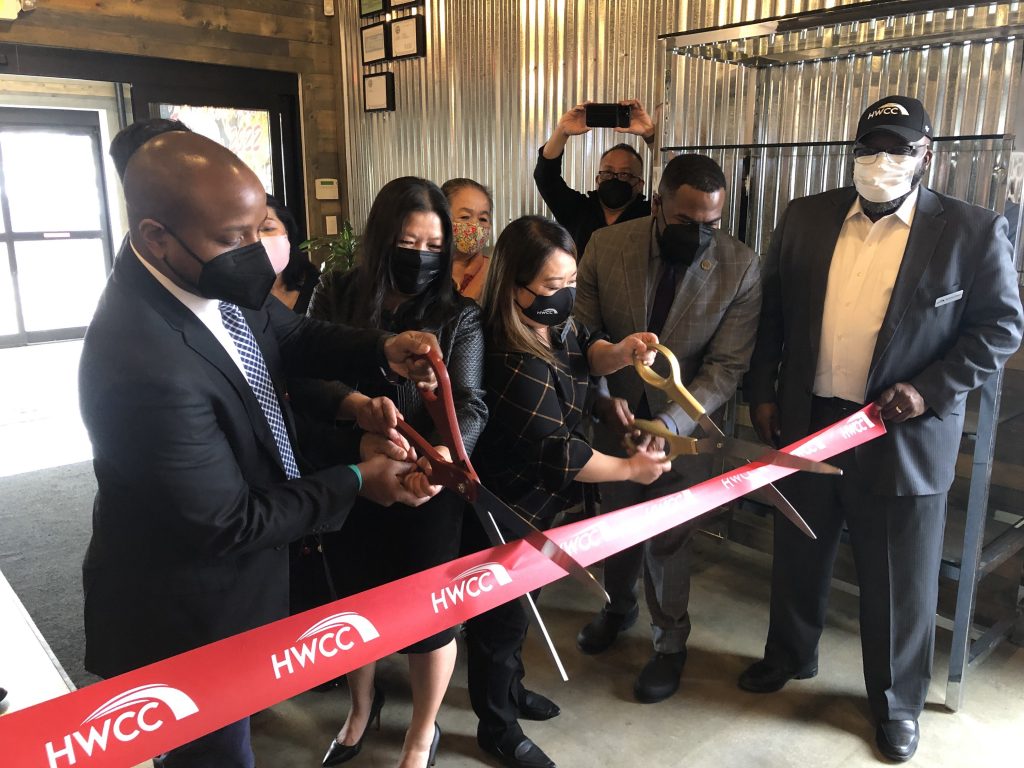 Acting Mayor Cavalier Johnson, AN OX owner Sia Xiong, Hmong Wisconsin Chamber of Commerce CEO Maysee Herr and DCD Commissioner Lafayette Crump cut the ribbon to open AN OX Cafe. Photo by Jeramey Jannene.