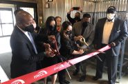 Acting Mayor Cavalier Johnson, AN OX owner Sia Xiong, Hmong Wisconsin Chamber of Commerce CEO Maysee Herr and DCD Commissioner Lafayette Crump cut the ribbon to open AN OX Cafe. Photo by Jeramey Jannene.