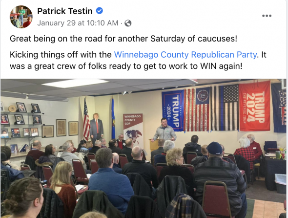 Lt. Gov. candidate and state Sen. Patrick Testin speaks in front of the flag of the Three Percenters, which represents and anti-government ideology. (Screenshot | Patrick Testin Facebook)