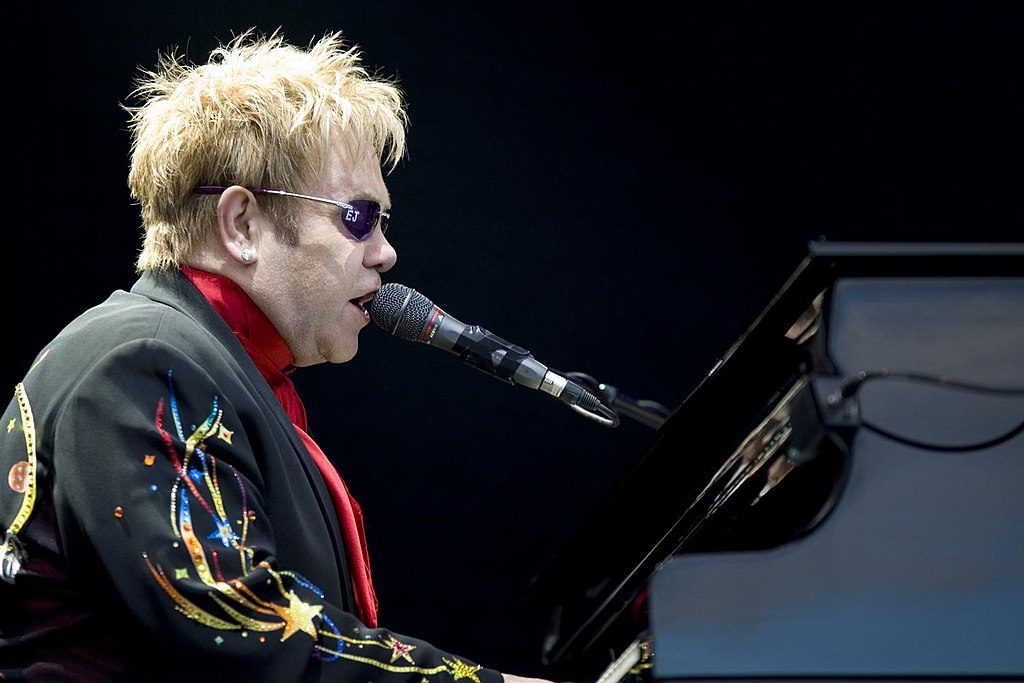 Elton John, July 12, 2008. Photo by Richard Mushet on Flickr, CC BY-SA 2.0 , via Wikimedia Commons