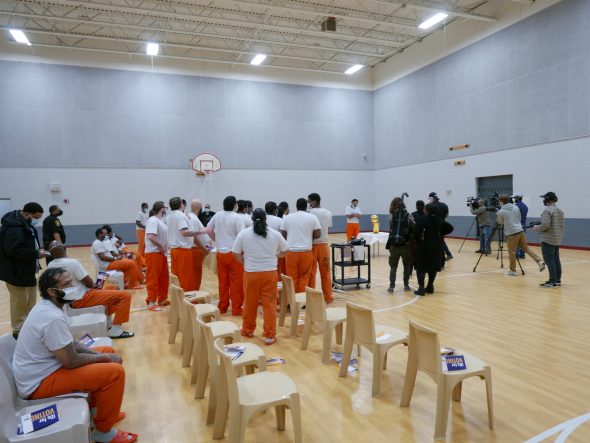 Inmates at the House of Correction lining up to have their picture taken with the Larry O’Brien Trophy. Photo taken March 29, 2022 by Graham Kilmer.