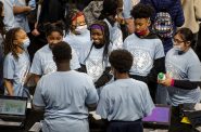 Students listen to a project being presented during a World Fair field trip Tuesday, April 19, 2022, in Milwaukee, Wis. Angela Major/WPR