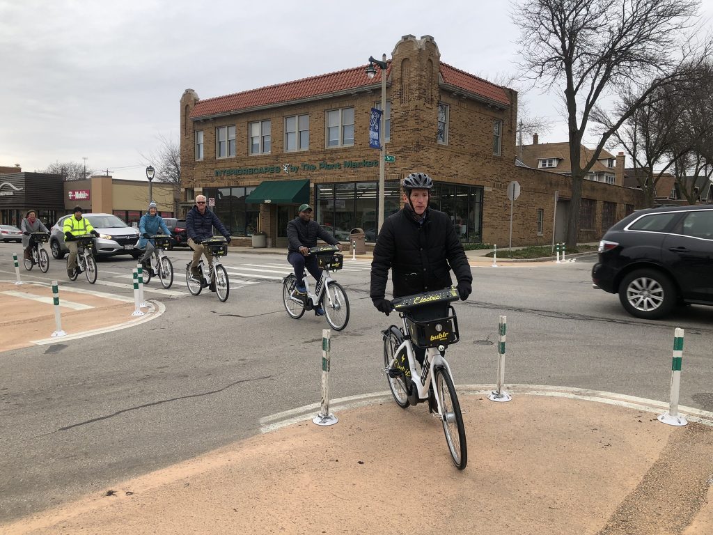 Wauwatosa Mayor Dennis McBride, followed by Milwaukee Mayor Cavalier Johnson, ride new Bublr e-bikes. Photo by Jeramey Jannene.