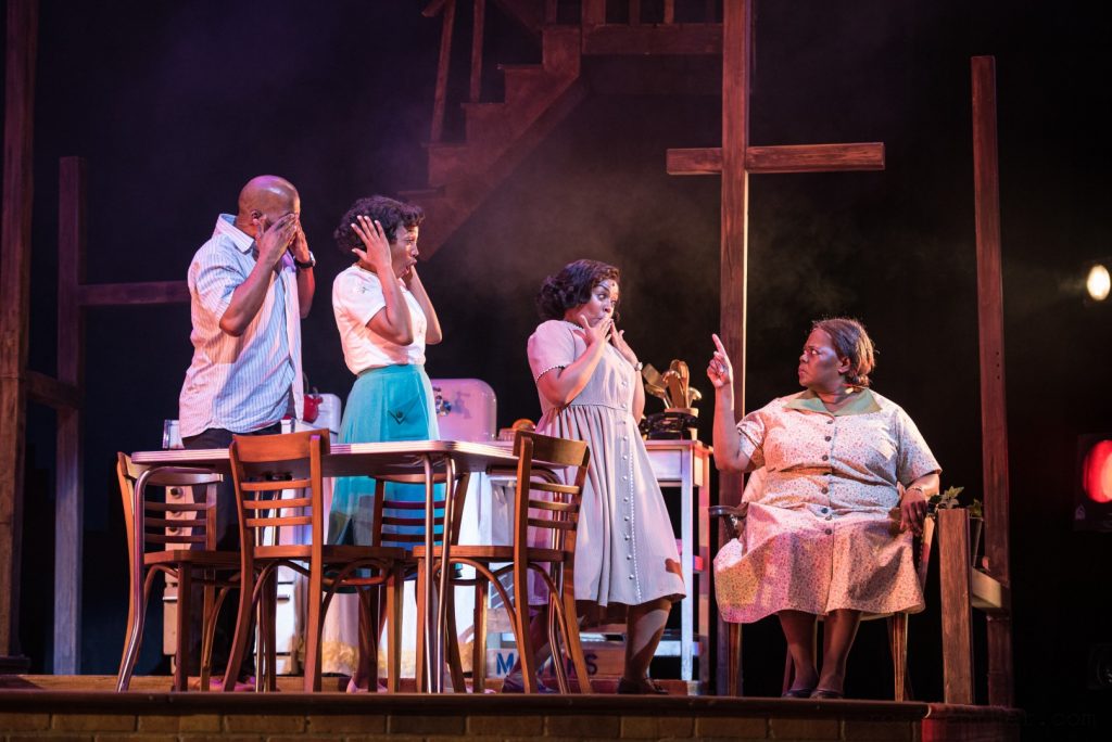 (l. to r.) J. Daughtry (Walter Lee Younger), Camara Stampley (Beneatha Younger), Melanie Loren (Ruth Younger) and Wydetta Carter (Lena Younger (Mama)) in Skylight Music Theatre’s production of Raisin running April 8-24, 2022. Photo by Ross Zentner.